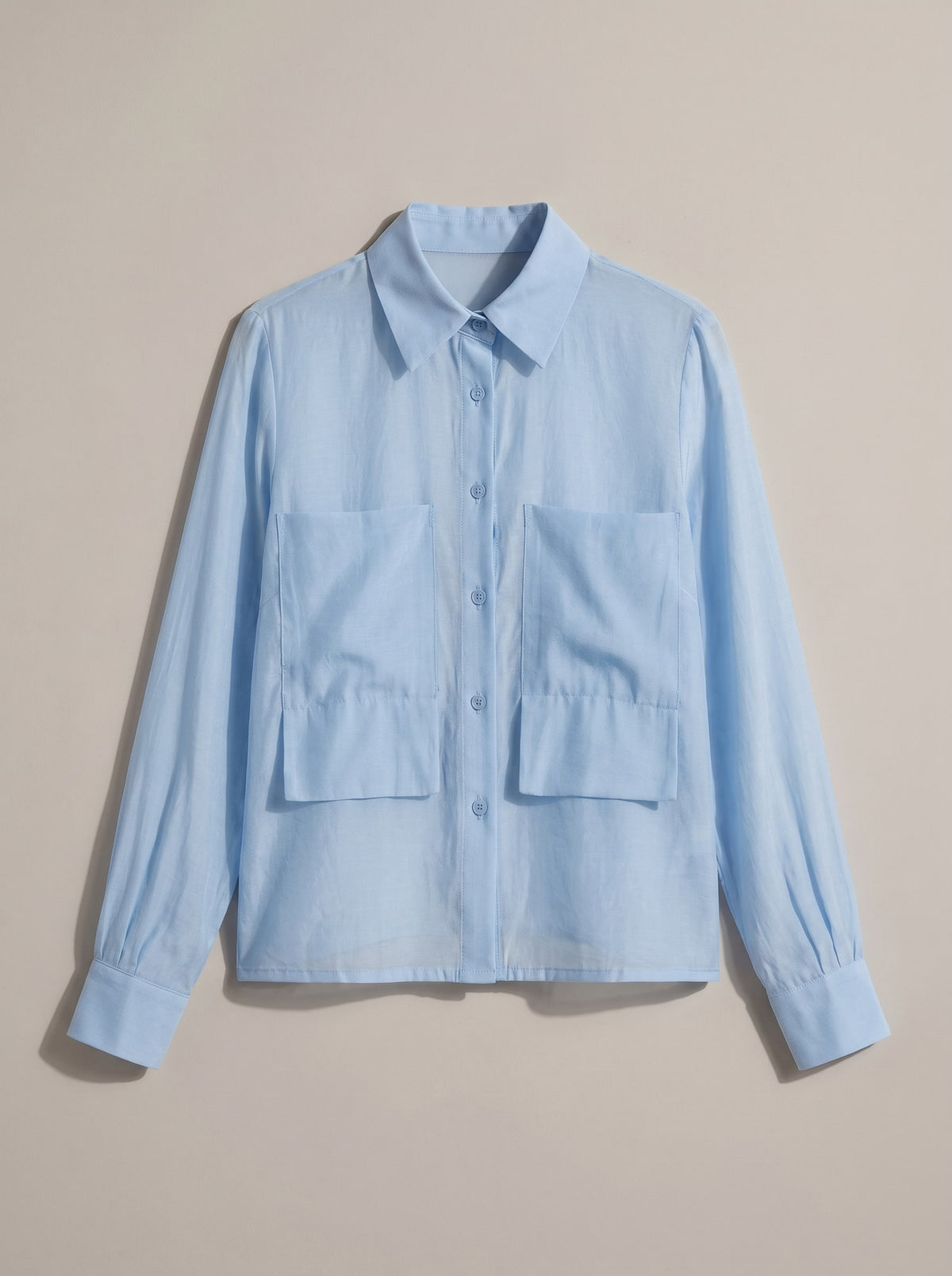CAMICIA SEMITRASPARENTE CON TASCHE Celeste - still life - IRONICA